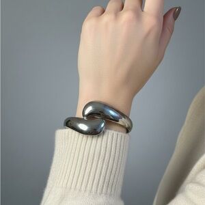 Silver-toned, wavy, open cuff bracelet
